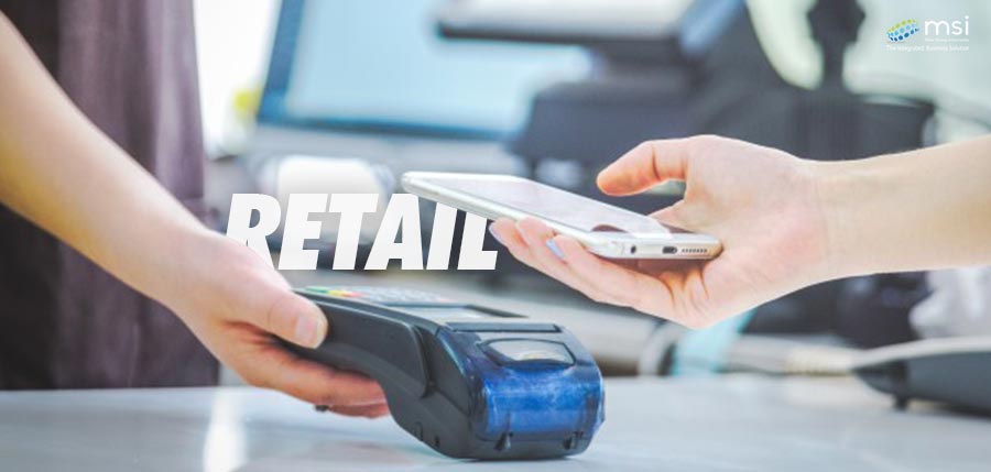 someone is holding a smartphone in a Retail supermarket